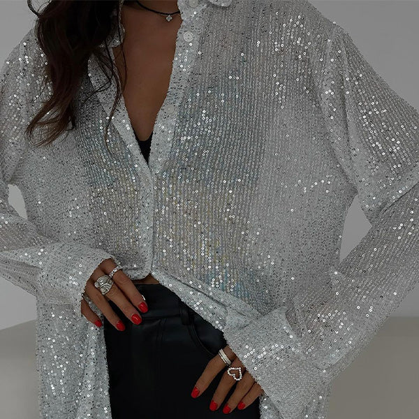 Damblus med glitter och paljetter – Avslappnad festtopp med eleganta långa ärmar