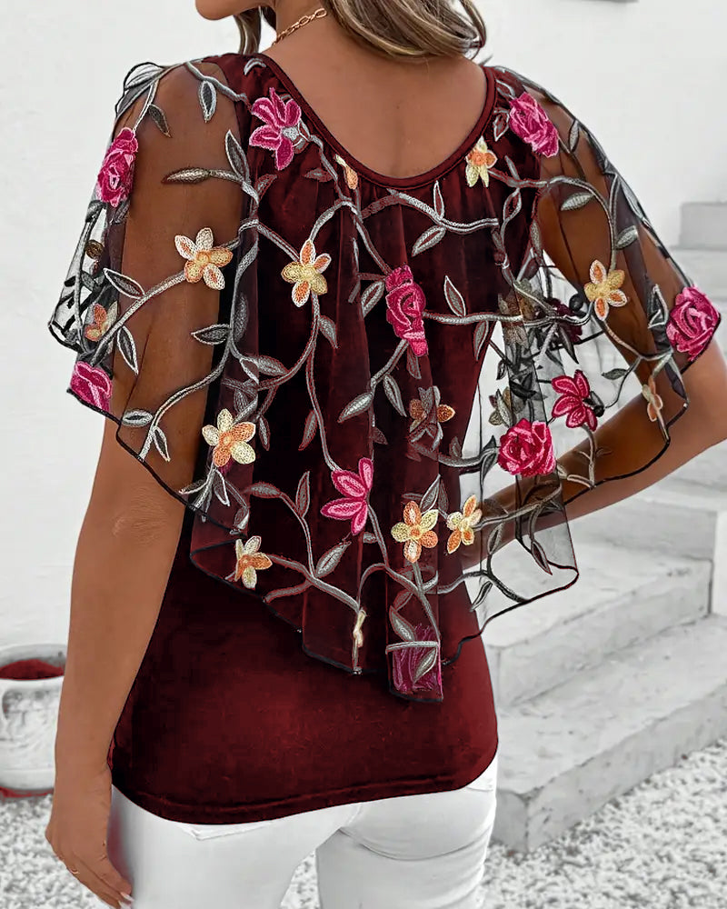 Transparent blus med blommig brodering för kvinnor