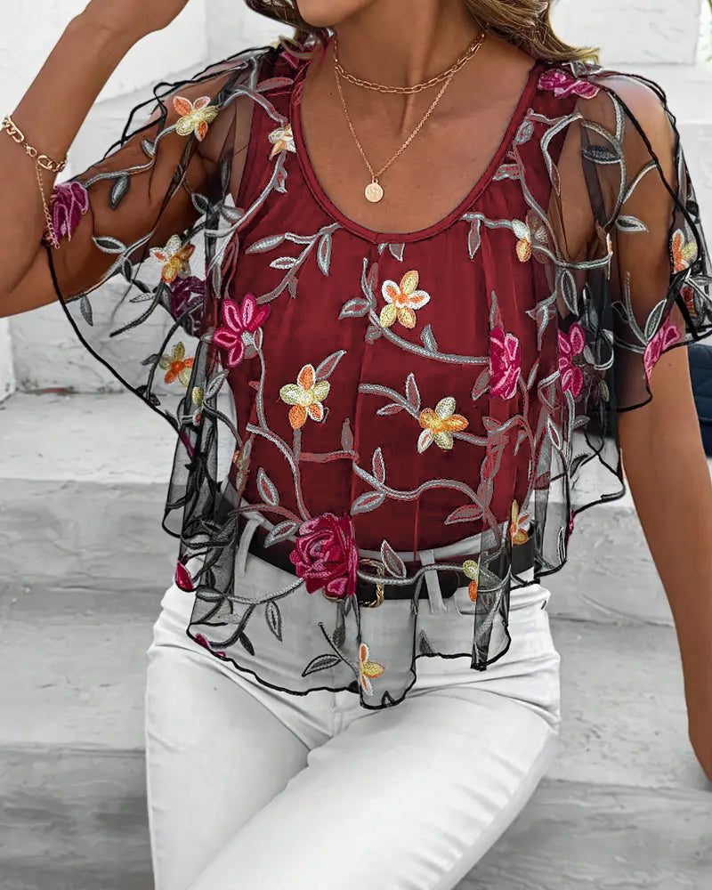 Transparent blus med blommig brodering för kvinnor