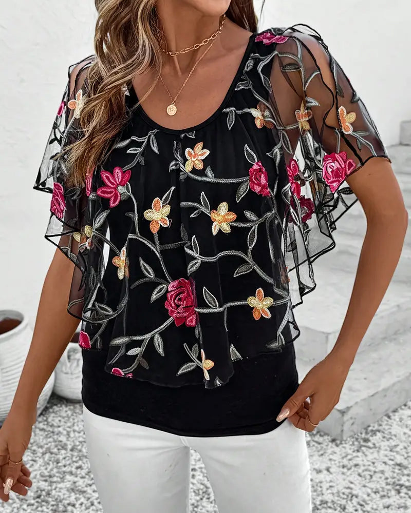 Transparent blus med blommig brodering för kvinnor