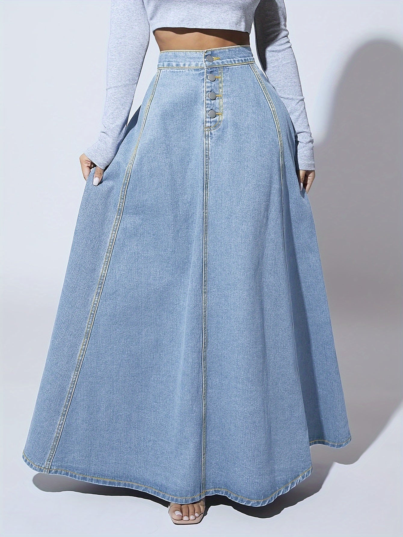 Damkjol i vintagetvättad denimmaxikjol - Högmidjad, utsvängd silhuett med tidlös streetwear