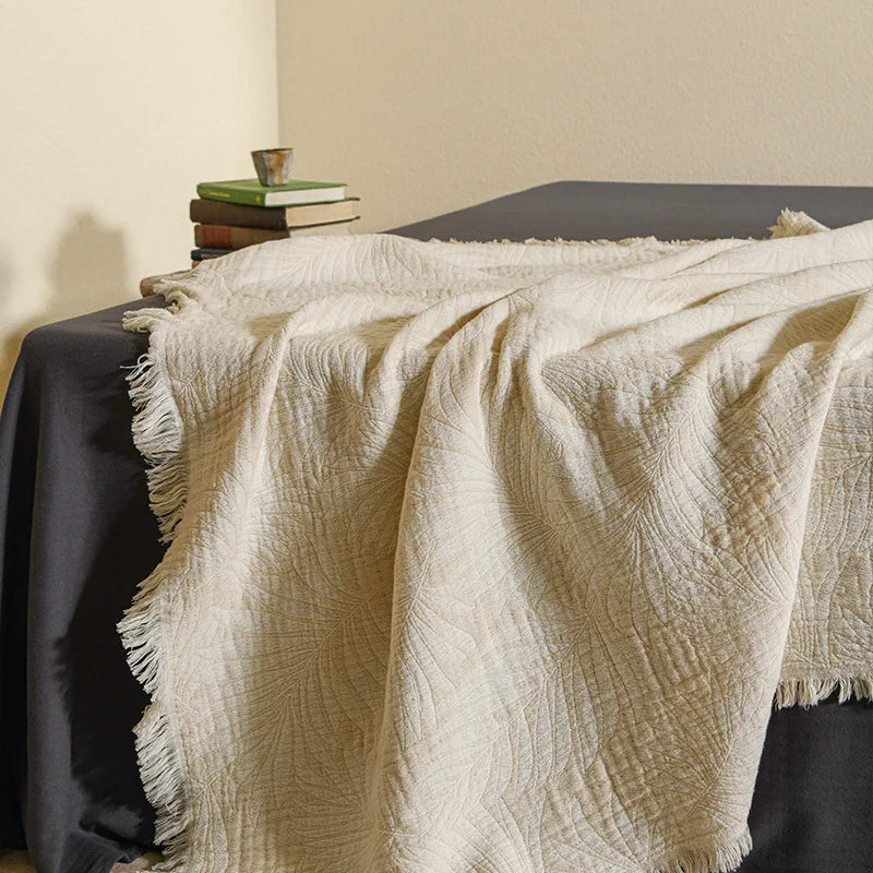 Mjuk muslinfilt i bomull med snyggt mönster och dekorativa tofsar – Mysig hemfilt