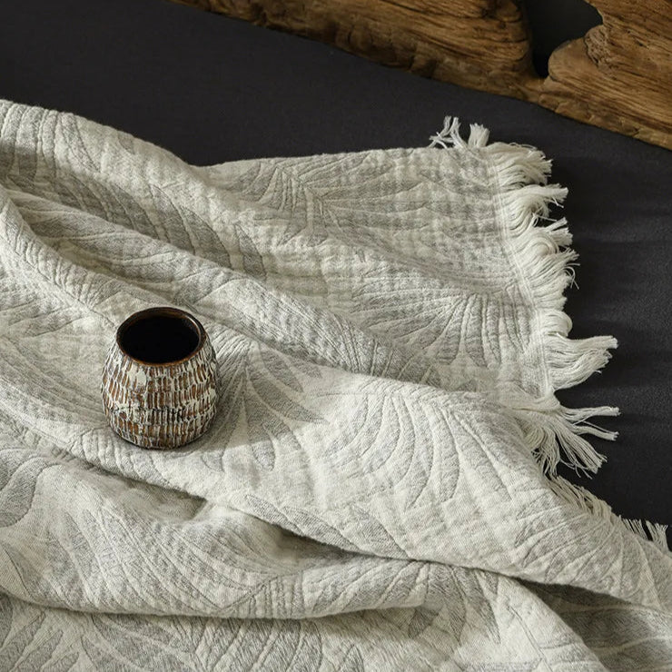 Mjuk muslinfilt i bomull med snyggt mönster och dekorativa tofsar – Mysig hemfilt