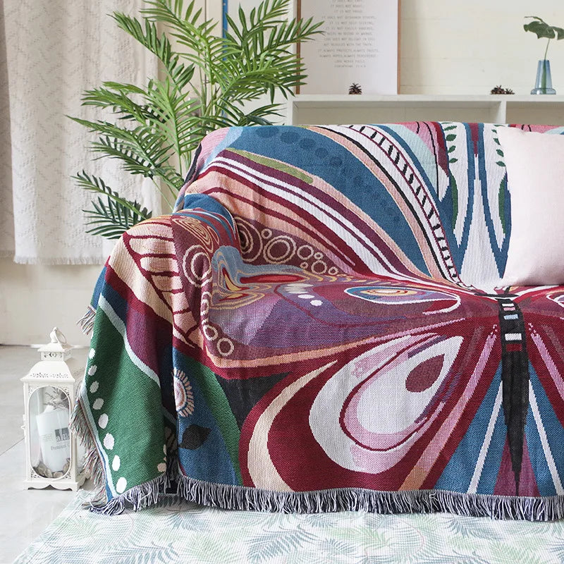 Elegant fjädermönstrad filt – Mysig påfågelinspirerad pläd för vardagsrum