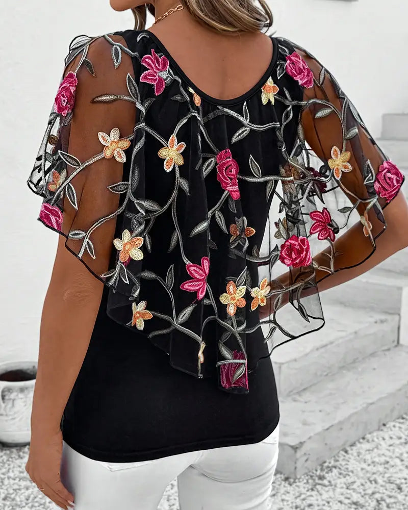 Transparent blus med blommig brodering för kvinnor