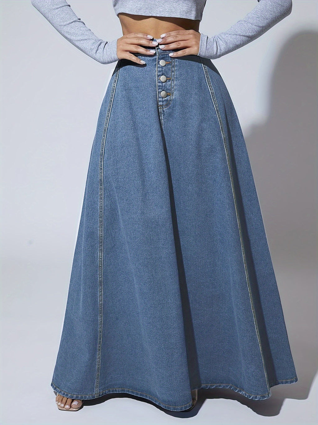 Damkjol i vintagetvättad denimmaxikjol - Högmidjad, utsvängd silhuett med tidlös streetwear