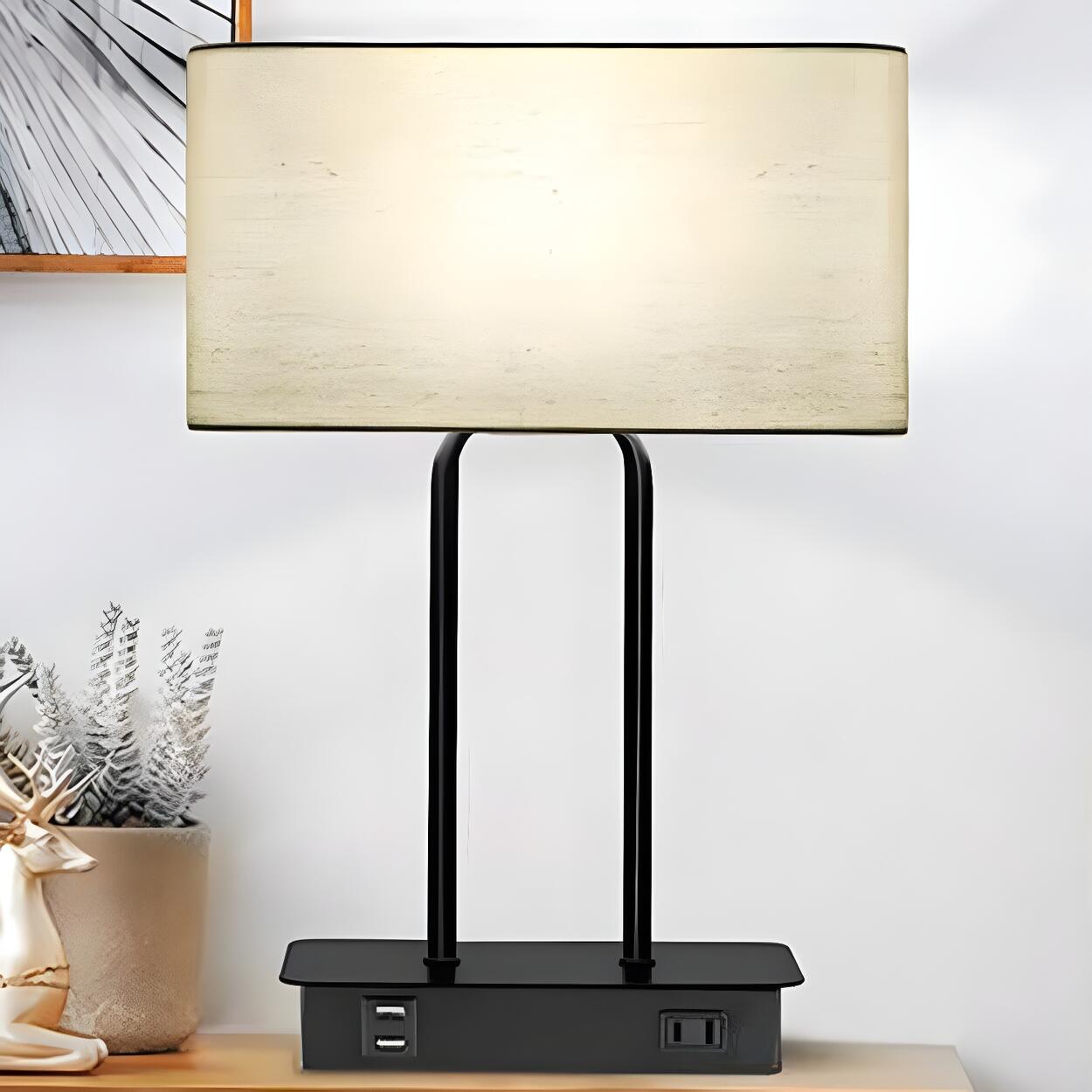 Modern bordslampa i tyg med trumma och elegant svart bas