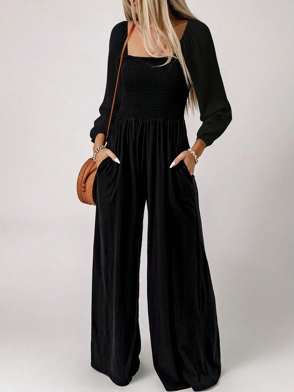 Damjumpsuit med charmig smockad midja – långärmad, avslappnad passform