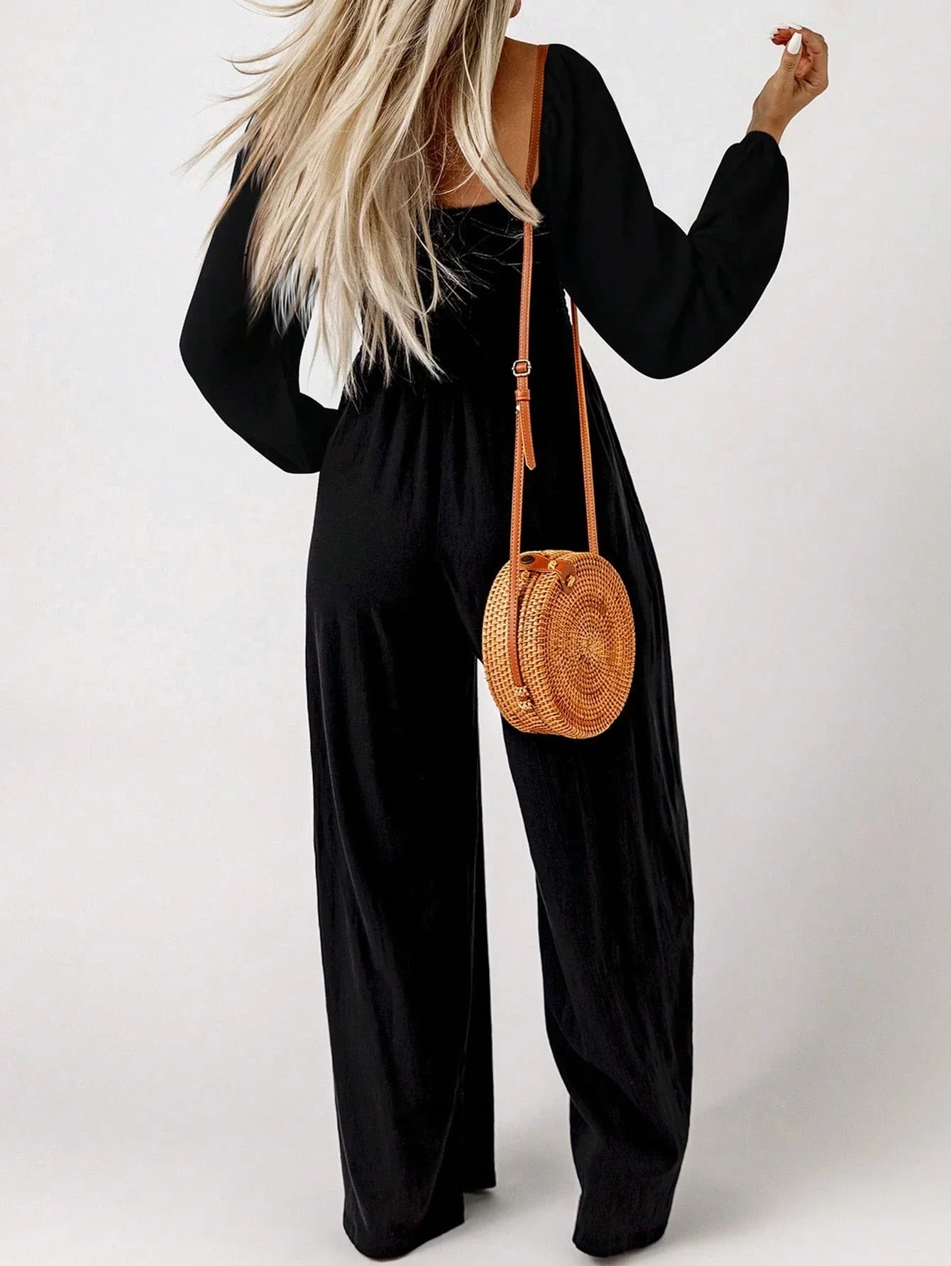 Damjumpsuit med charmig smockad midja – långärmad, avslappnad passform