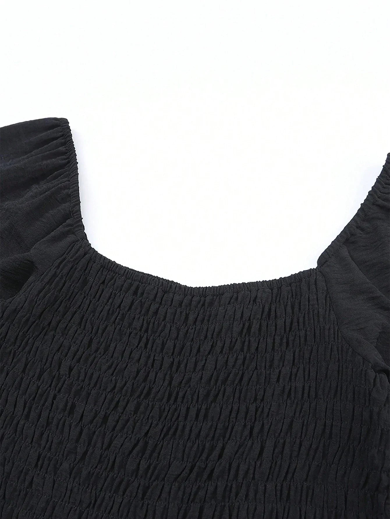 Damjumpsuit med charmig smockad midja – långärmad, avslappnad passform